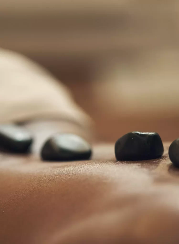 Hot stone massage lined up on the back