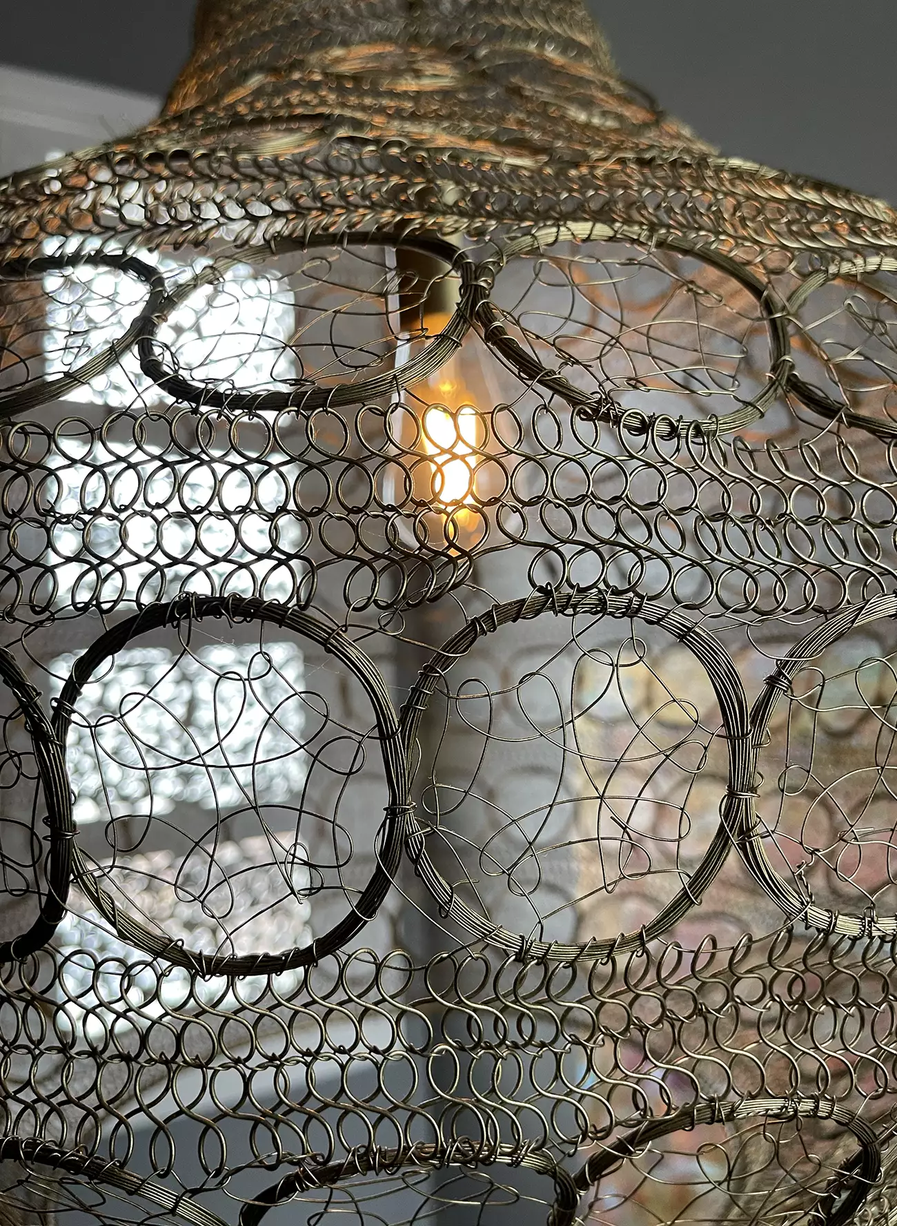 Closeup of gorgeous metal mesh pendant light in stairwell at Daylesford Day Spa