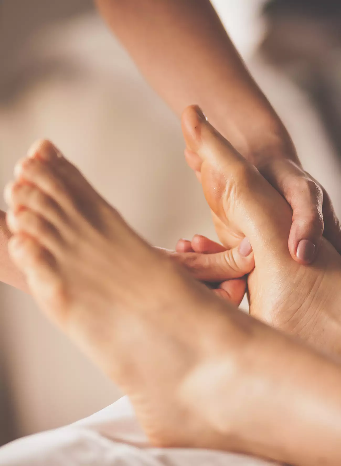 Thumb pressure on ball of foot during foot massage