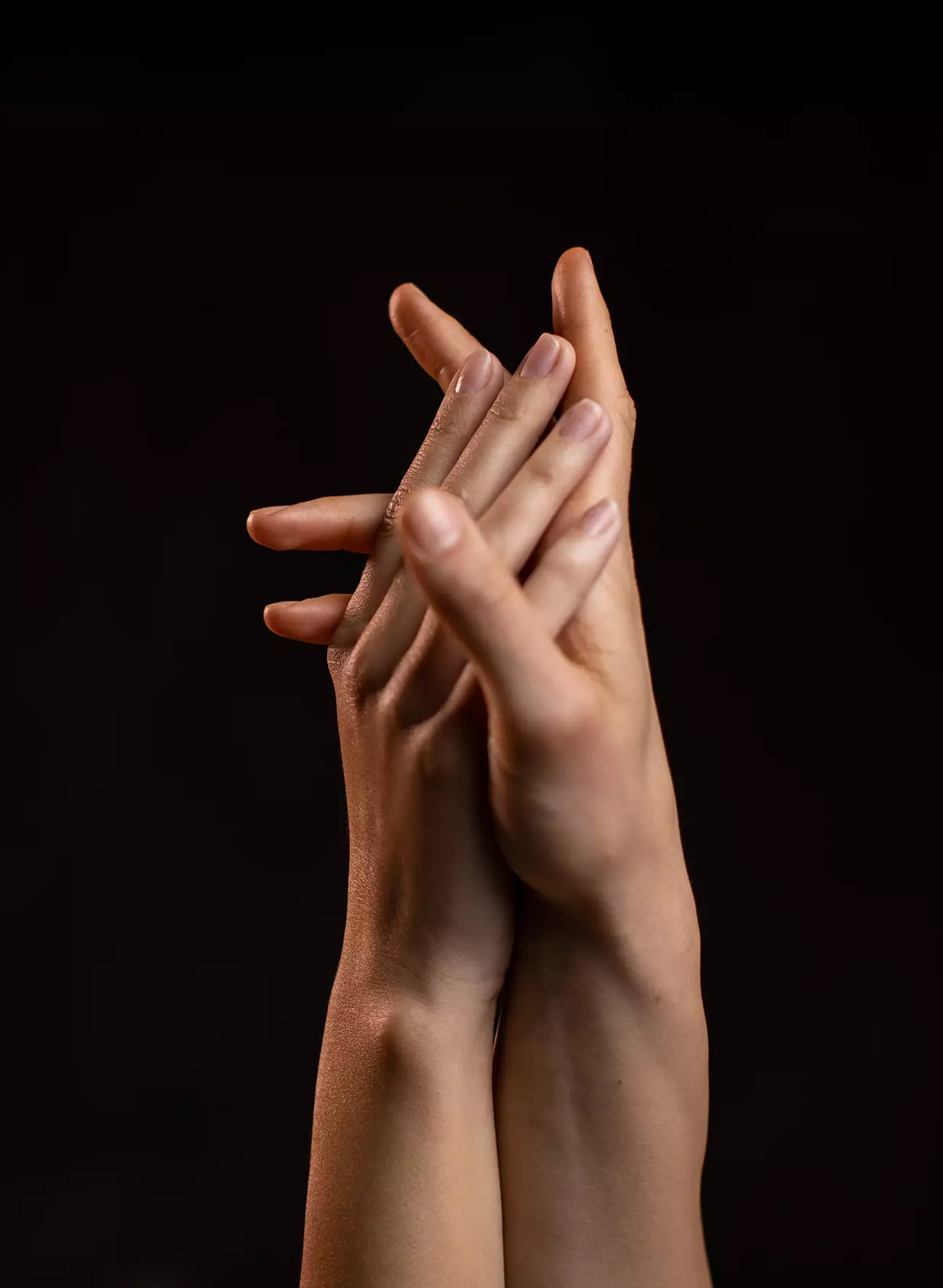 Female hands clasping together