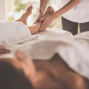 Couple enjoying foot massage at day spa